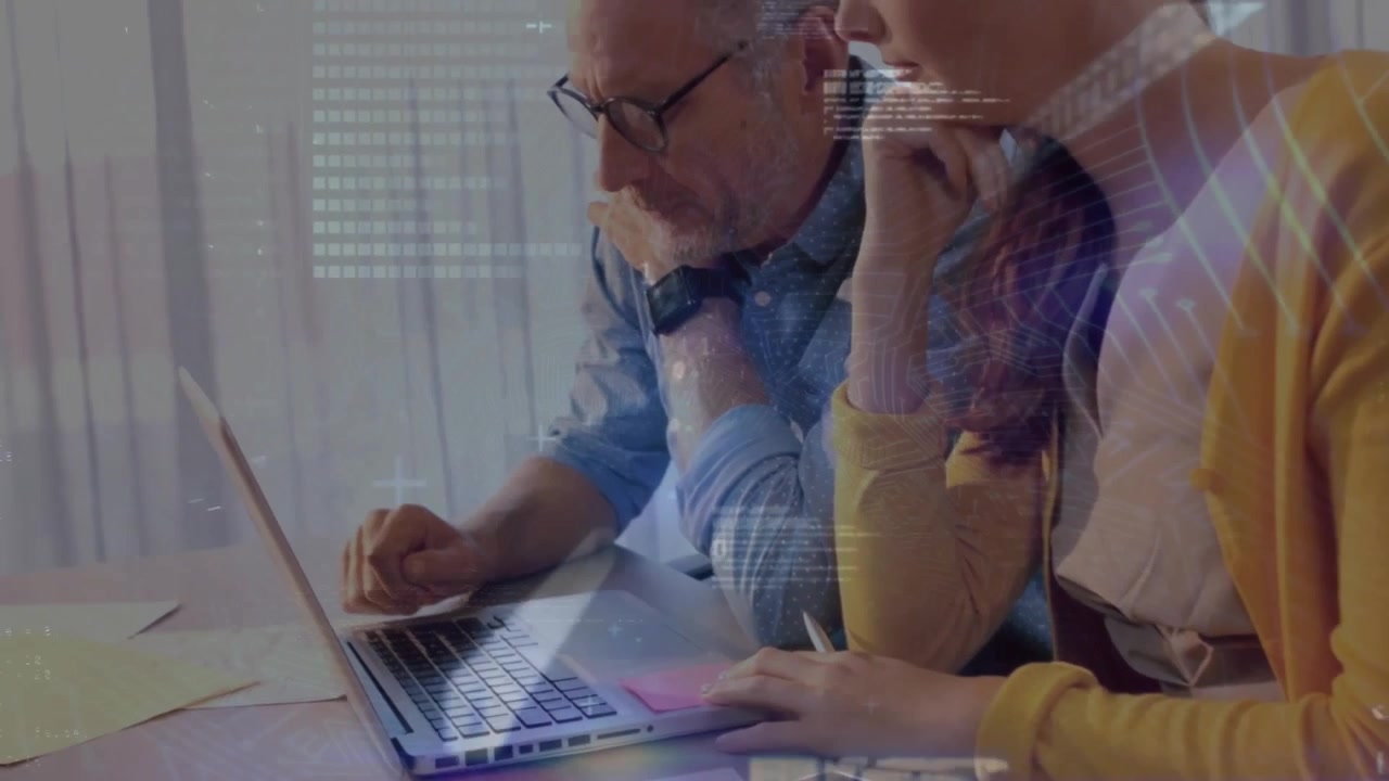Animation of data processing over caucasian business people using laptop