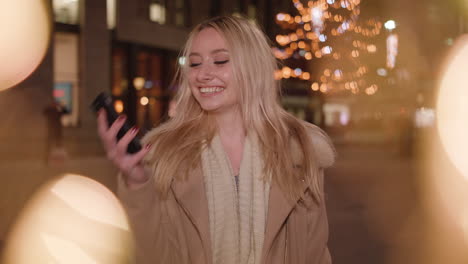 young-attractive-woman-chats-with-her-friend-on-the-phone-and-smiles