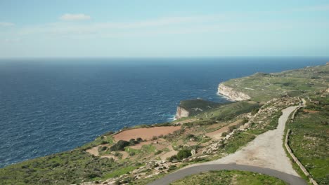 AERIAL:-Dingli-Cliffs-with-Greeny-Nature-and-Blue-Sea-and-Sky-in-Malta-Island