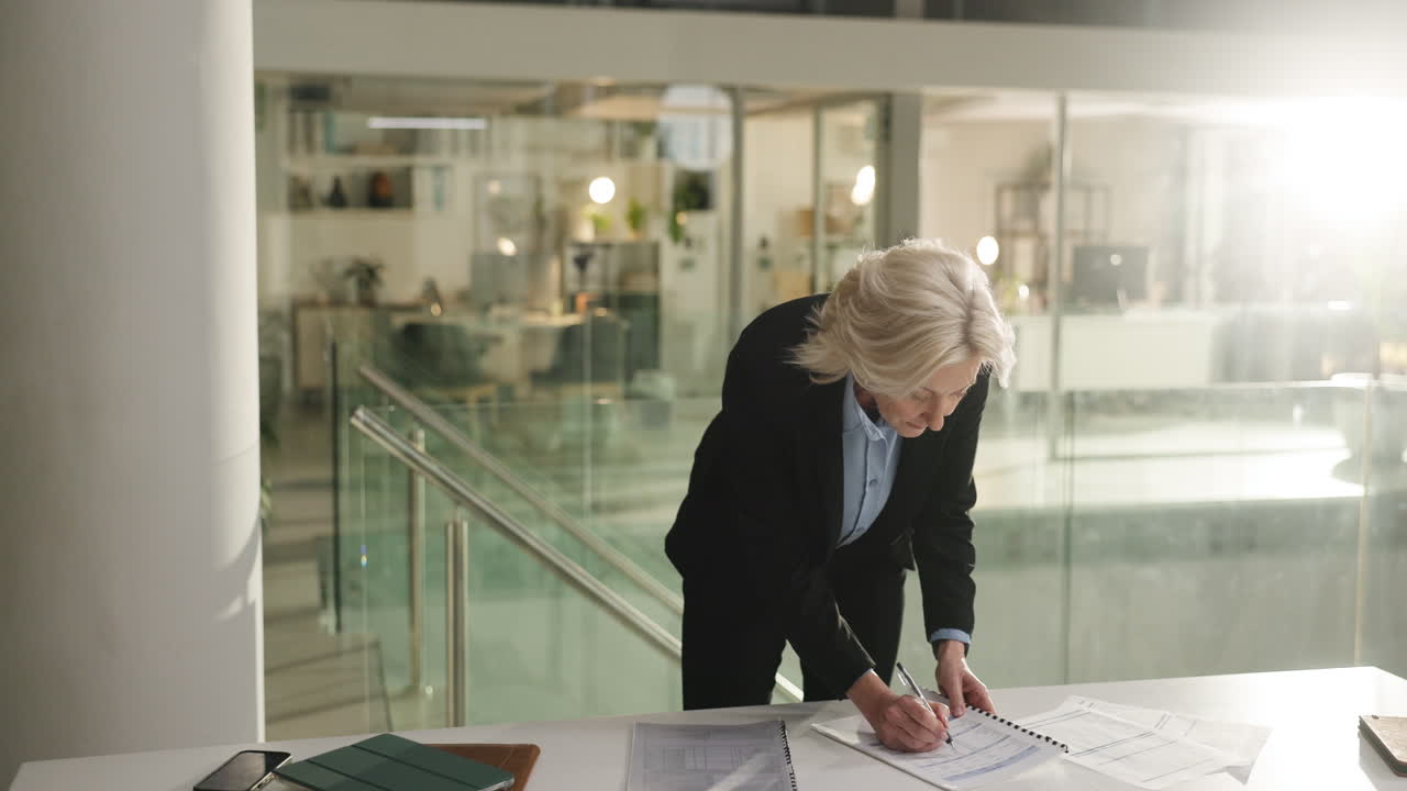 Businesswoman working with documents in office