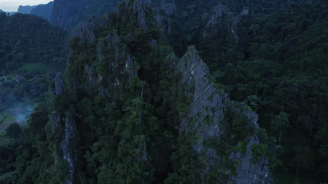 Aerial View of Lush Green Mountains and Cliffs