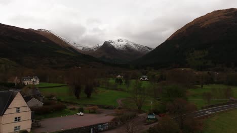 Aerial-rising-shot-revealing-the-snowy-beinn-a-bheithir-in-the-Scottish-Highlands