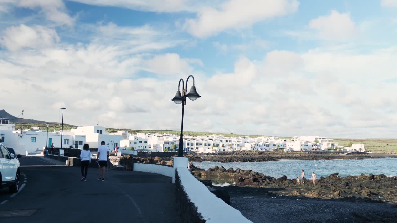 Coastal Town Scene with White Buildings and Ocean View