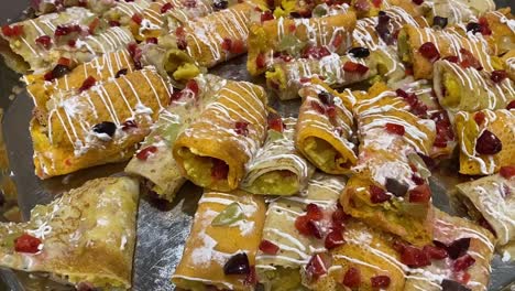 Flavoured-pati-sapta-Bengali-sweet-served-with-white-cream-and-resins