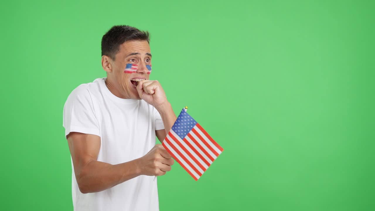 Nervous United States supporter during an exciting match looking away