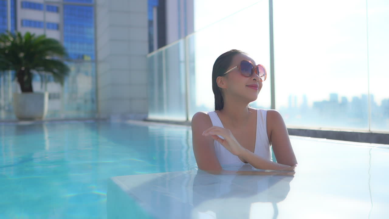 Sophisticated Female Beauty in Modern Outdoor Hotel Swimming Pool