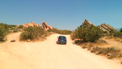 aerial view of driving a car in the desert