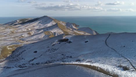 snowy mountainous coastline