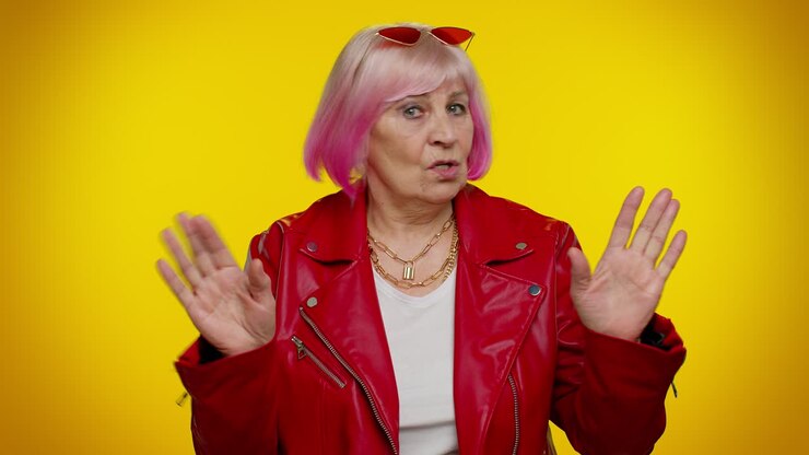 Confused senior old granny woman pointing fingers himself ask say who me no thanks i do not need it