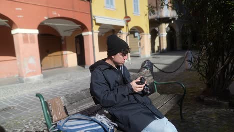 Young Man Taking Pictures in a European City