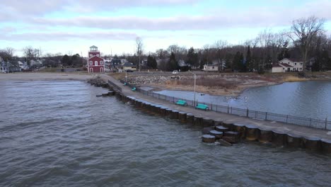 the pier at luna pier and lighthouse on a moody day in usa