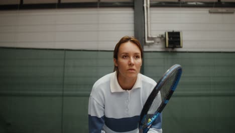 woman preparing to play tennis