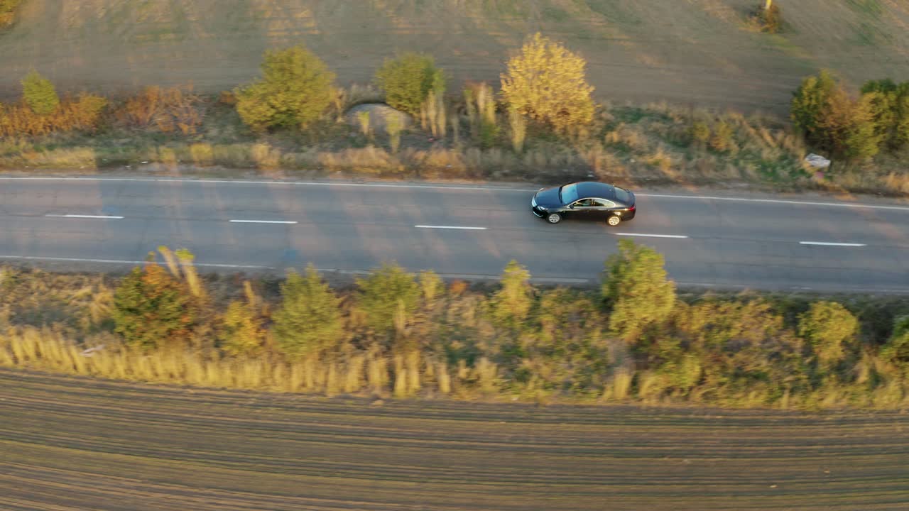 Aerial View of Cars Driving on a Country Road