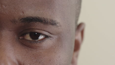 close up african american man eye looking pensive staring at camera eyesight vision