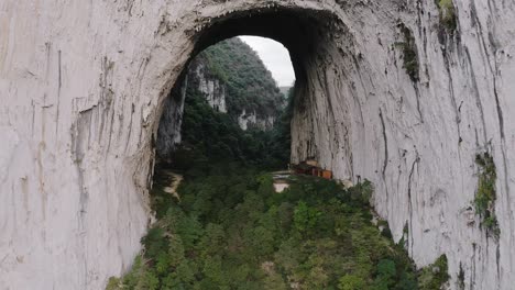 Iconic-Great-Arch-of-Getu,-karst-mountain-rock-climbing-in-China,-aerial-view