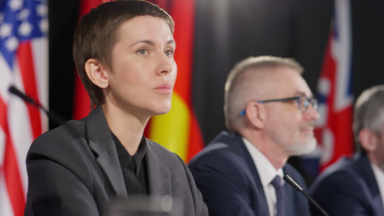 Diplomats Talking at International Press Conference