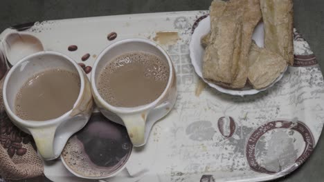 hot tea served in cup with refreshment close up in details