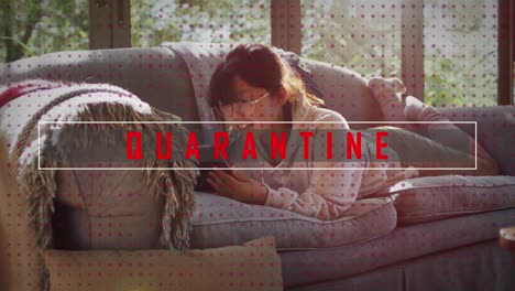 Animation-of-quarantine-text-over-woman-using-smartphone