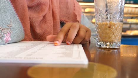 woman ordering food at a cafe