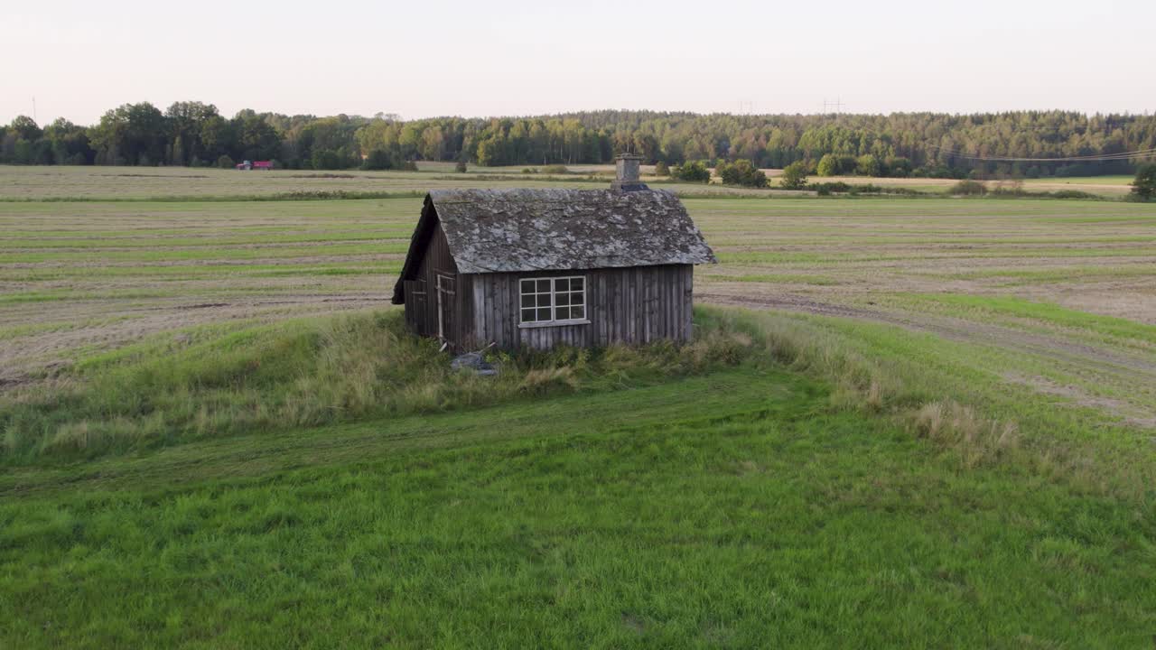 Remains Of A Historical Blacksmith Shop Standing In The Agricultural Land In Dalsland, Sweden. Aerial Drone Shot