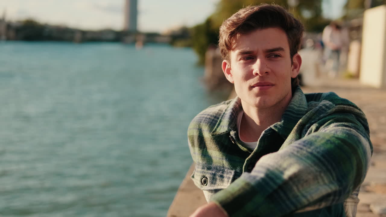 Contemplative Man by the Guadalquivir River in Seville