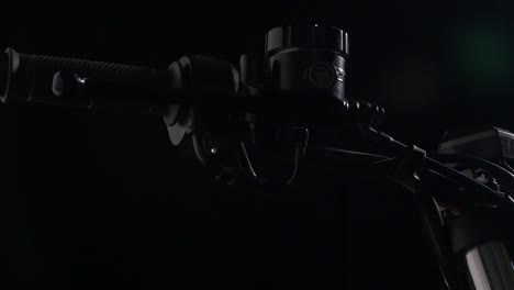 motorcycle handlebar on a dark background slider shot