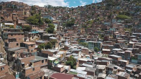 Drone-aerial-view,-flying-over-houses-in-ghetto-poor-area-of-Comuna-13-slums,-Medellin,-Colombia