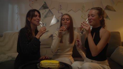 friends celebrating with champagne and cake