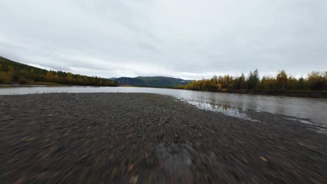 experience the breathtaking natural beauty of yakutia as a drone glides over rivers and autumn foliage, showcasing the region's stunning contrasts in a unique way