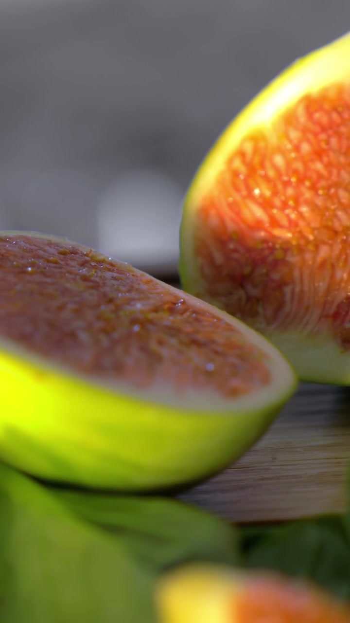 Cut green figs and basil leaves