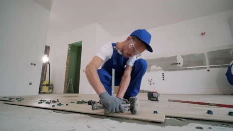 installing ceramic floor tiles - measuring and cutting the pieces. construction, renovation, repair apartment. cuts tile. tile cutting