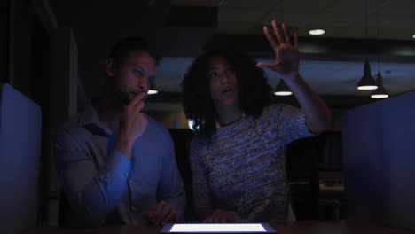 young office executives working over digital tablet in a modern office