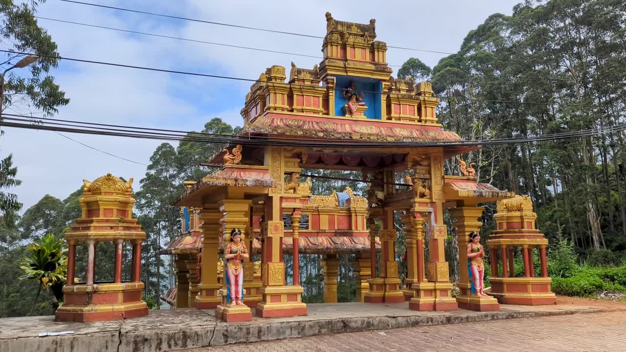 Buddhist temple gate entrance to Devon Falls waterfall in highlands of Sri Lanka