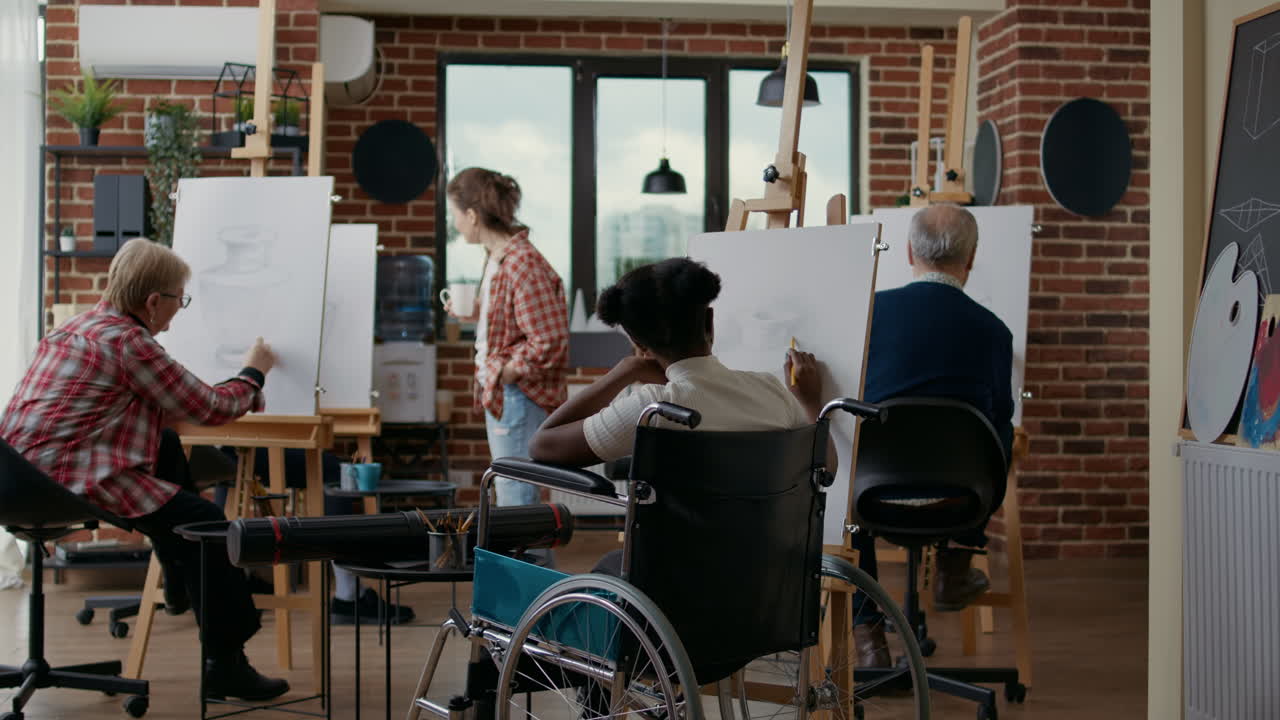 Young woman with disability learning to draw sketch on canvas