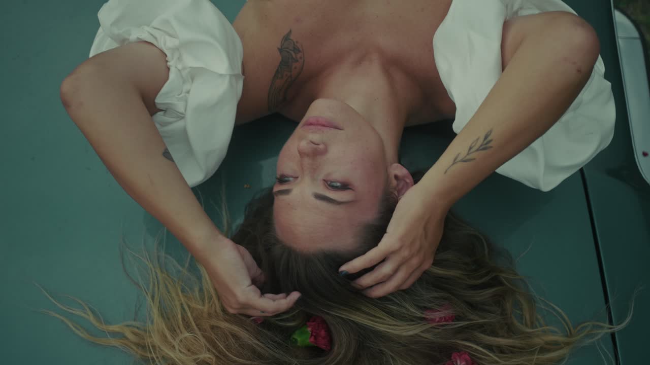Woman Lying on a Vintage Car