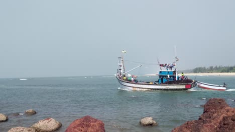 fishing boats heading deep into arabian sea at betul fort goa, india