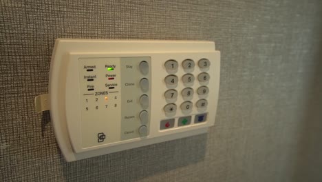 new and white indoor home security panel, close up