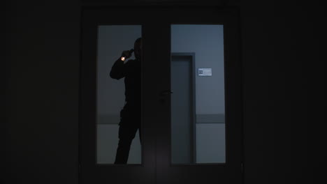 Man-in-uniform-working-on-the-corridor