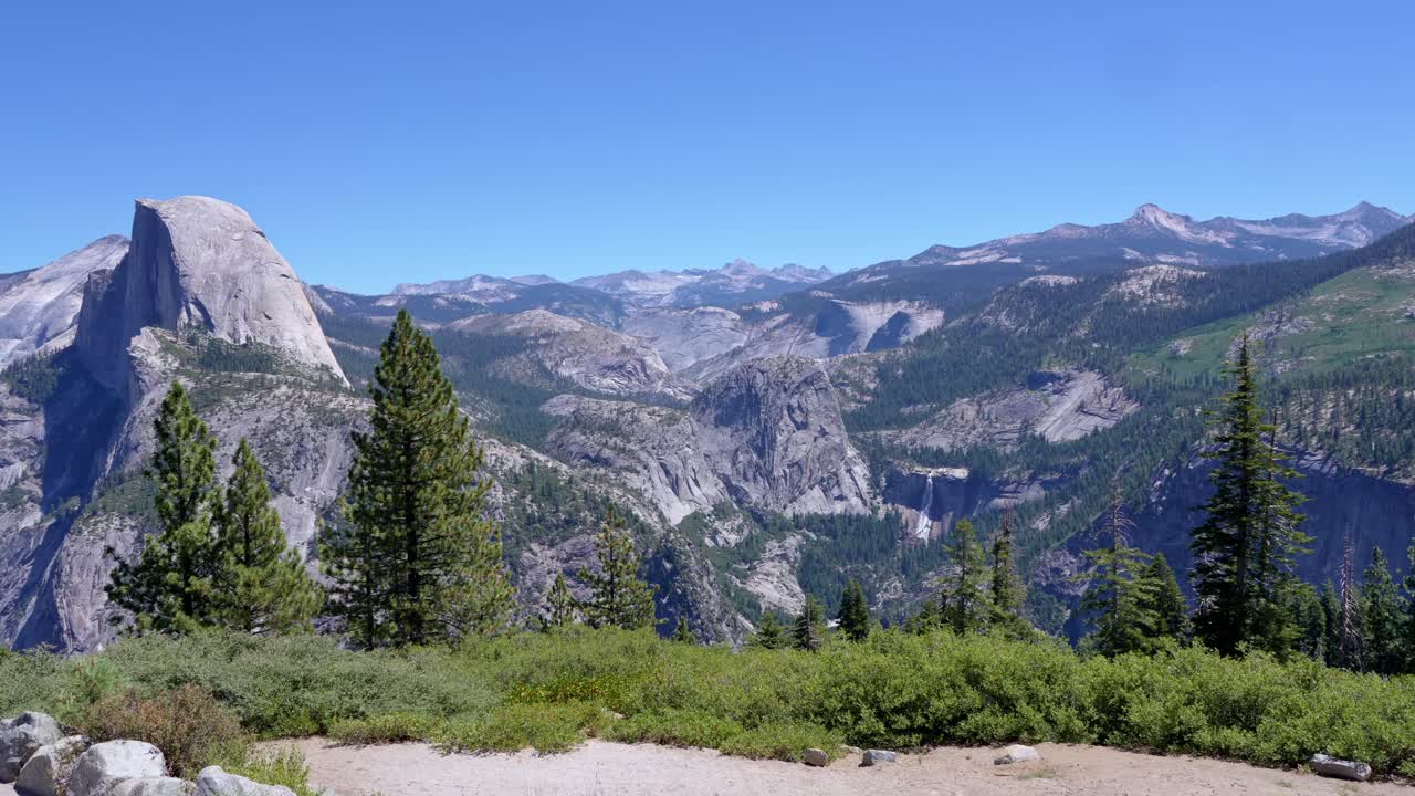 Sweeping panoramic shot captures Yosemite’s iconic Half Dome beside the plunging Nevada Falls in crisp 4K. Perfect for travel, nature and adventure projects seeking majestic Sierra scenery