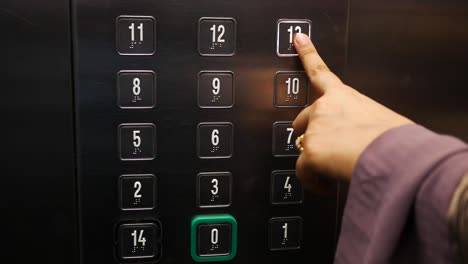 person pressing elevator button