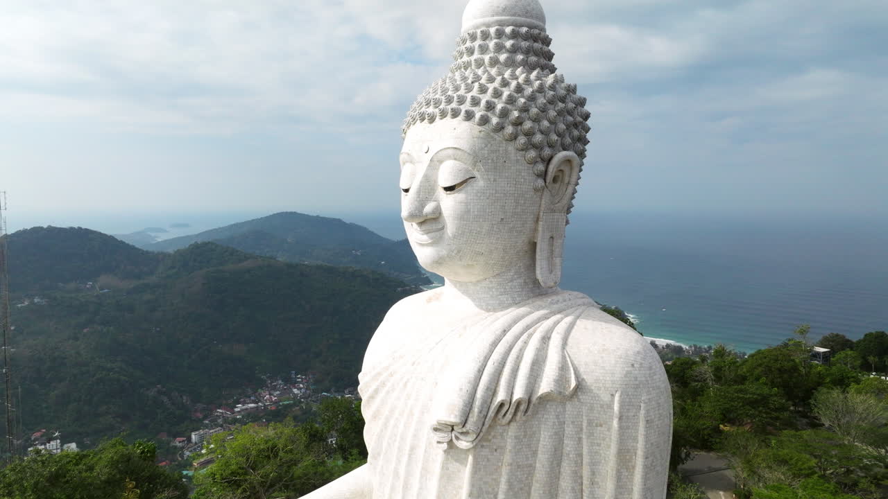 Closeup Of The Big Buddha In Phuket, Thailand - Phra Phutta Ming Mongkol Eknakiri. - aerial pullback shot