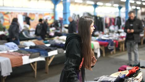 woman shopping at a thrift store