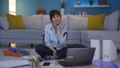 Home-office-worker-woman-biting-her-nails-looking-at-camera.