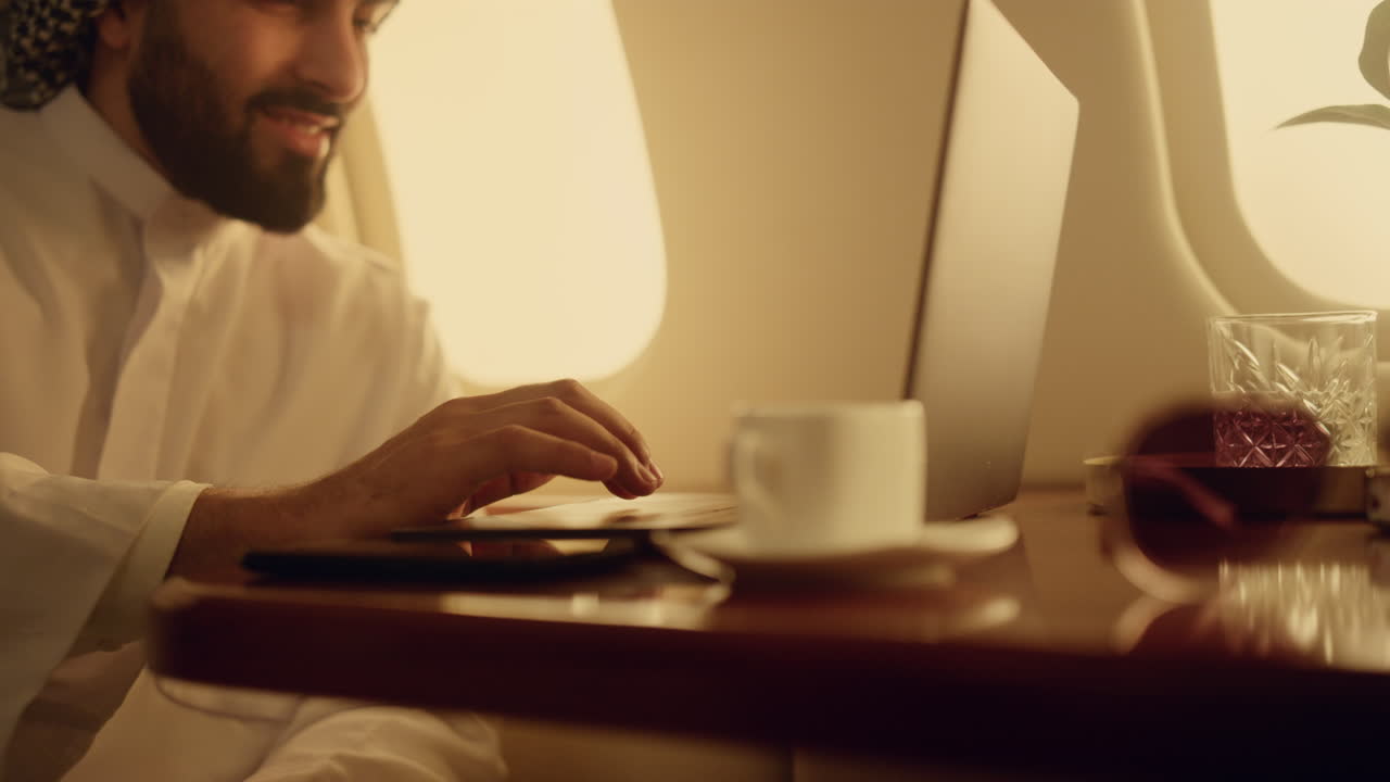 Cheerful businessman browsing internet. Closeup hand typing laptop keyboard