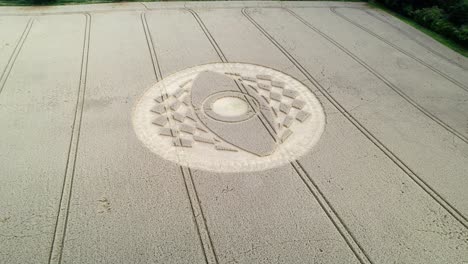 intricate design of crop circle in dry farm land, west meon