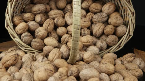 a pile of walnuts lies in the wicker basket