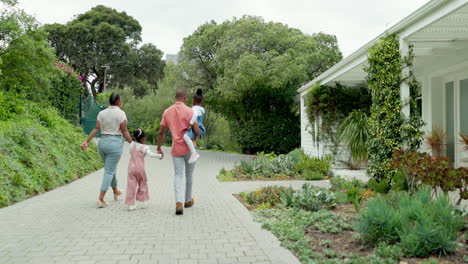 family, holding hands and walking together to