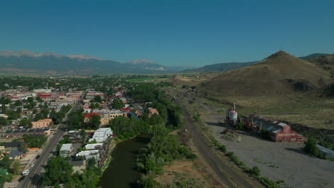 Aerial-cinematic-drone-mid-summer-downtown-Salida-S-Colorado-near-Buena-Vista-on-Arkansas-River-Riverside-Park-Scout-surfing-wave-mountain-biking-hiking-rafting-Rocky-Mountain-backwards-movement