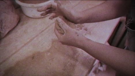 young woman makes a jug of clay. female hands mold pottery