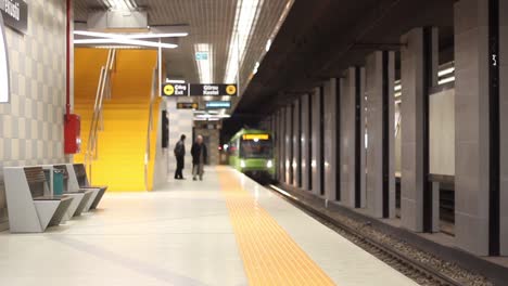 Underground-Train-Stops-At-A-Platform-And-Passengers-Embark-And-Disembark